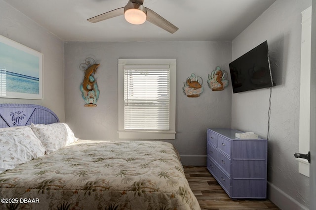 bedroom featuring dark wood-type flooring and ceiling fan