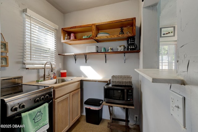 kitchen with sink, range with electric cooktop, and light brown cabinets