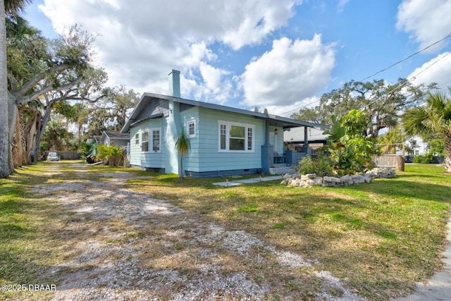 exterior space with a yard