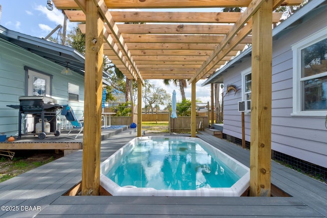 view of pool with a wooden deck, a hot tub, and a pergola