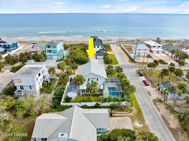 drone / aerial view with a water view and a residential view