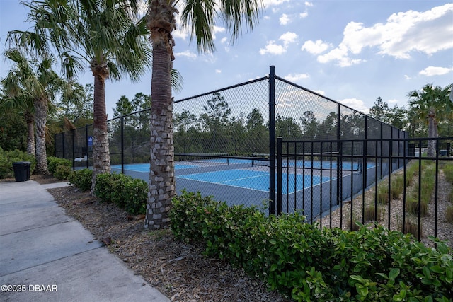 view of sport court with fence