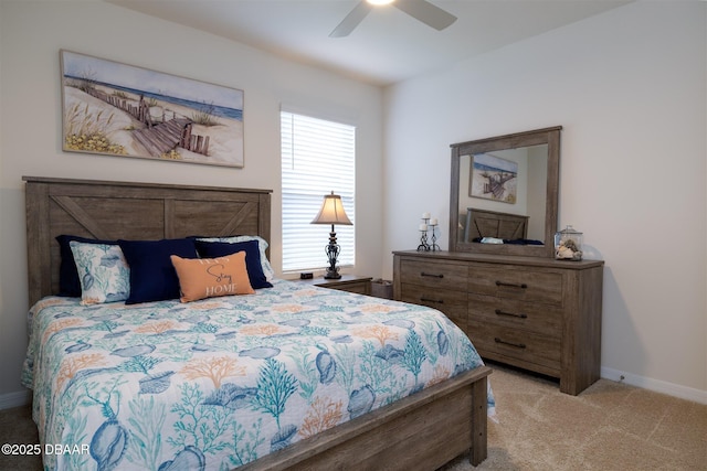 carpeted bedroom featuring ceiling fan and baseboards