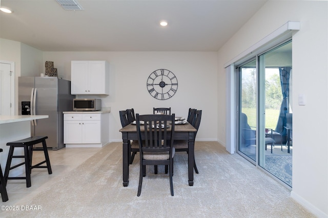 dining space featuring baseboards, visible vents, and recessed lighting