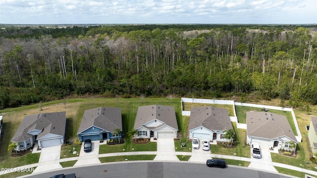 aerial view with a residential view and a view of trees