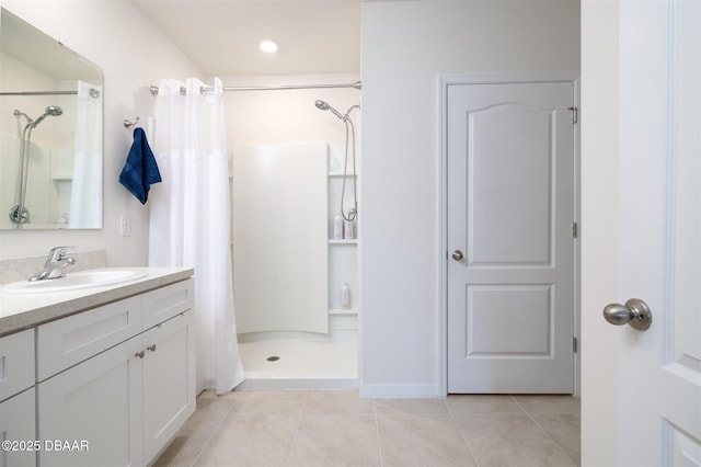 bathroom with tile patterned flooring, vanity, and a shower with curtain