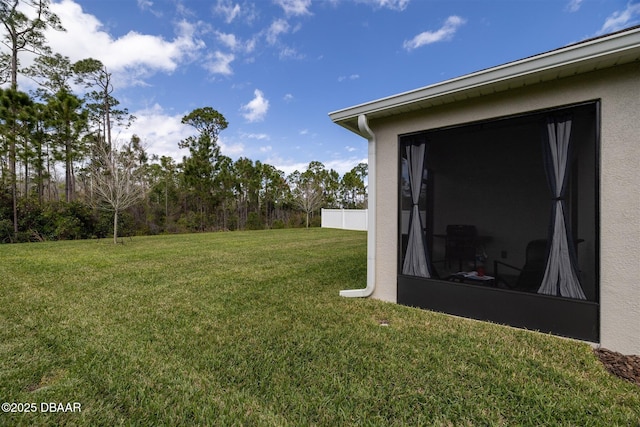 view of yard with a sunroom