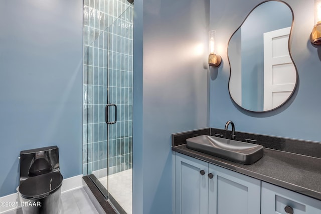 bathroom with a stall shower and vanity