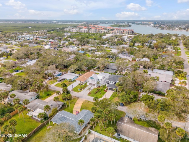 birds eye view of property with a residential view and a water view