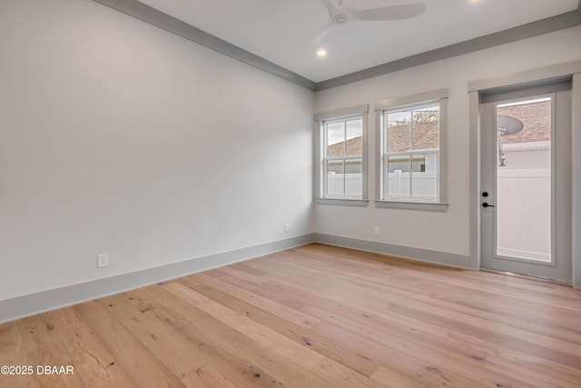 empty room featuring a ceiling fan, light wood-style flooring, baseboards, and recessed lighting