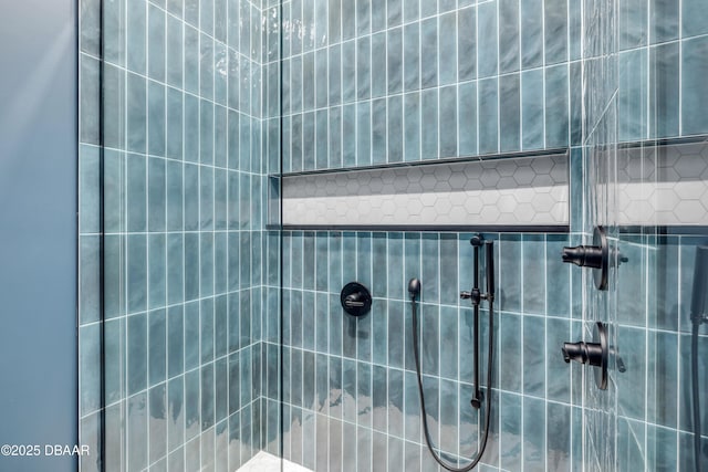 bathroom with tiled shower