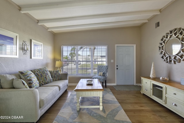 living room with dark hardwood / wood-style floors and vaulted ceiling with beams