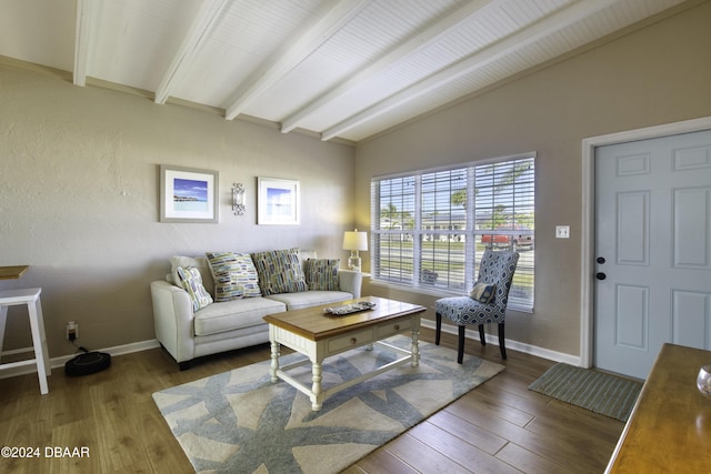 living room with wood-type flooring and vaulted ceiling with beams