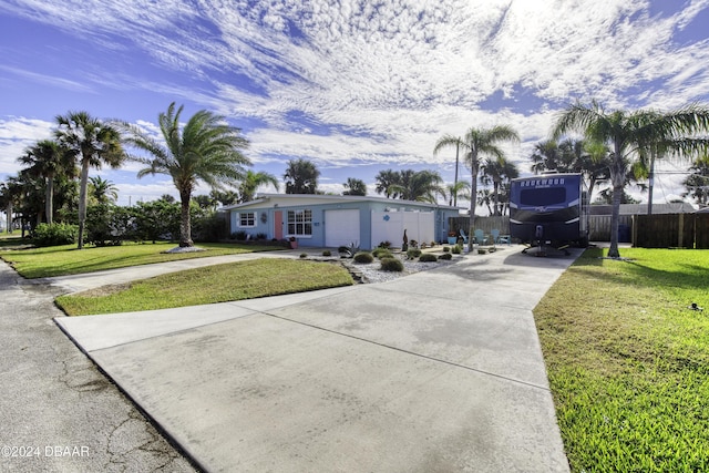 view of front of home with a garage and a front yard