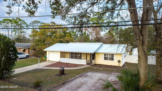 ranch-style home with a garage and a front yard