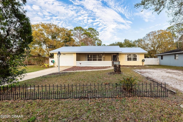 ranch-style home with a garage and a front yard