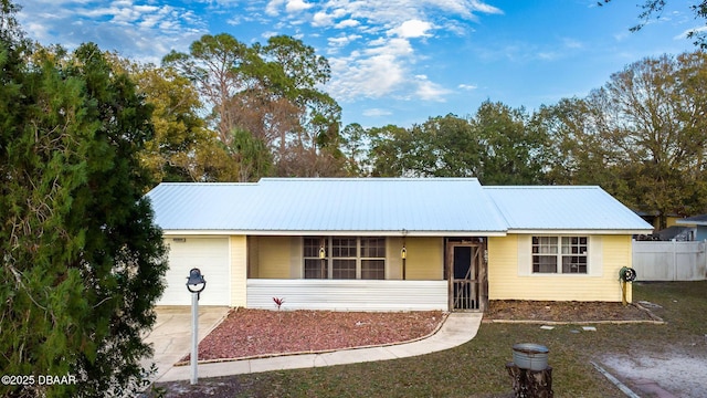 ranch-style house featuring a garage