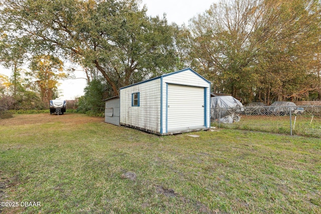 view of outdoor structure featuring a lawn