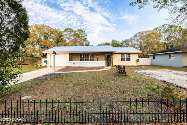 ranch-style home featuring a garage and a front yard