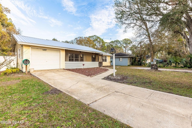 single story home with a garage and a front lawn