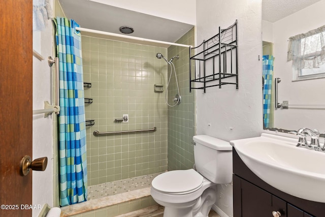 bathroom featuring vanity, a shower with shower curtain, and toilet