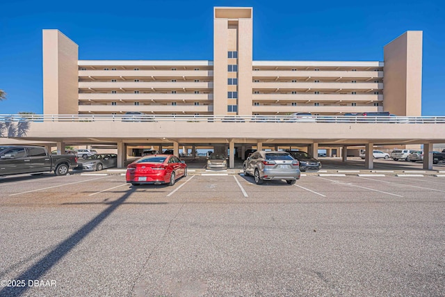 4453 S Atlantic Ave Unit 606, Port Orange, FL 32127 - view of property featuring covered parking