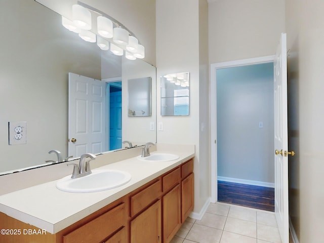 bathroom featuring tile patterned flooring and vanity