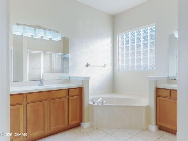 bathroom with vanity, tile patterned floors, and shower with separate bathtub