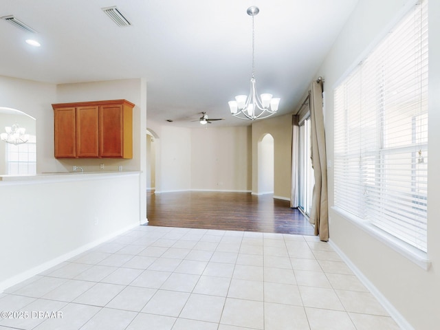 kitchen with stainless steel appliances, sink, and light tile patterned floors