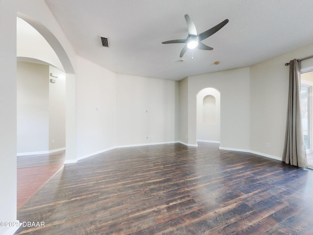 unfurnished bedroom with ceiling fan, lofted ceiling, dark hardwood / wood-style flooring, and a closet