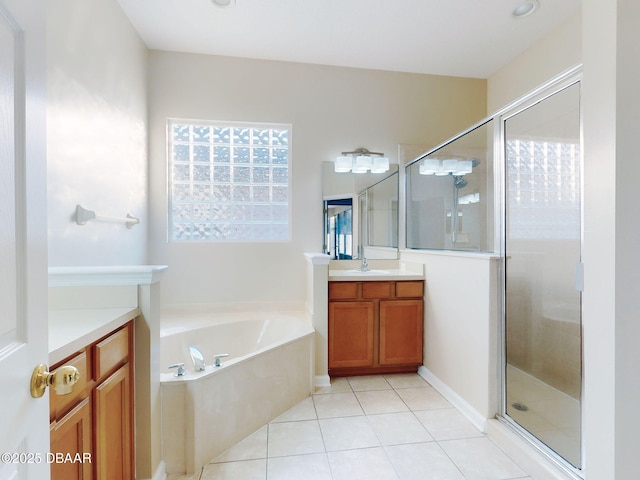 bathroom with tile patterned flooring, vanity, and plus walk in shower