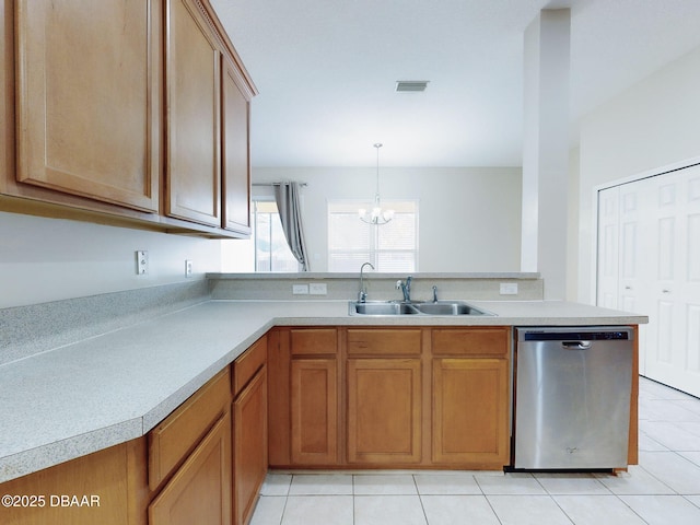 kitchen with dishwasher, sink, and light tile patterned floors