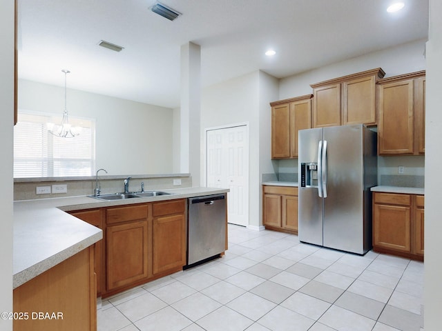 kitchen with stainless steel appliances and light tile patterned flooring