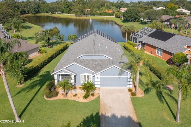 birds eye view of property with a water view