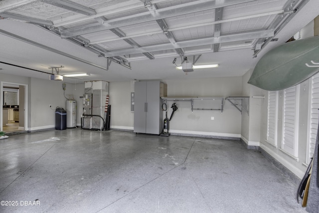 2809 Oakgrove Ave, Saint Augustine, FL 32092 - garage featuring heating unit, electric water heater, and a garage door opener