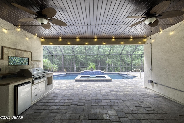 2809 Oakgrove Ave, Saint Augustine, FL 32092 - view of patio featuring a ceiling fan, an outdoor kitchen, a lanai, and a pool with connected hot tub