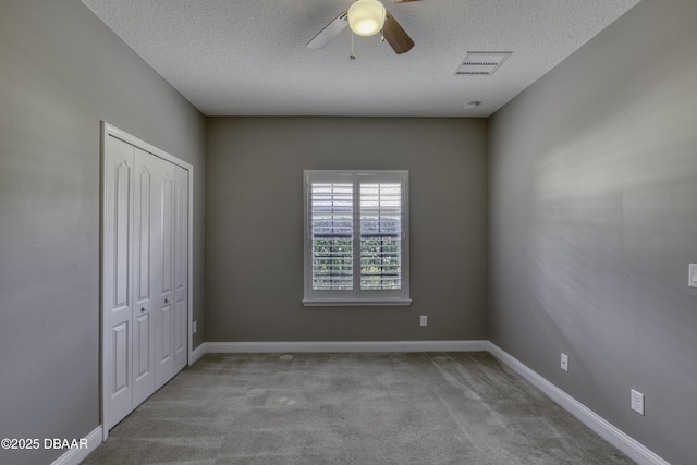 2809 Oakgrove Ave, Saint Augustine, FL 32092 - unfurnished bedroom with a textured ceiling, carpet flooring, a closet, and ceiling fan