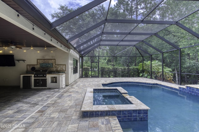 2809 Oakgrove Ave, Saint Augustine, FL 32092 - view of pool with an outdoor kitchen, a patio, a pool with connected hot tub, ceiling fan, and a lanai