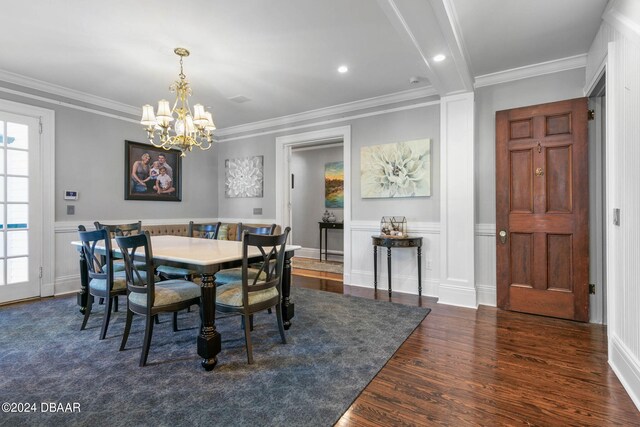 dining room featuring a notable chandelier, dark hardwood / wood-style floors, and crown molding