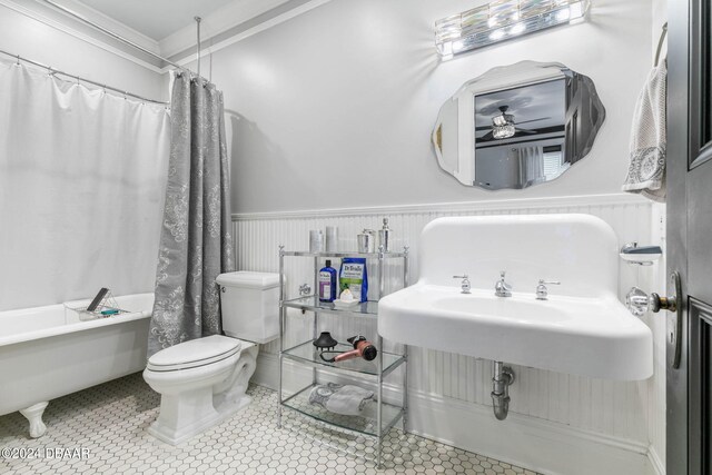 bathroom featuring ceiling fan, tile patterned flooring, toilet, and shower / bathtub combination with curtain