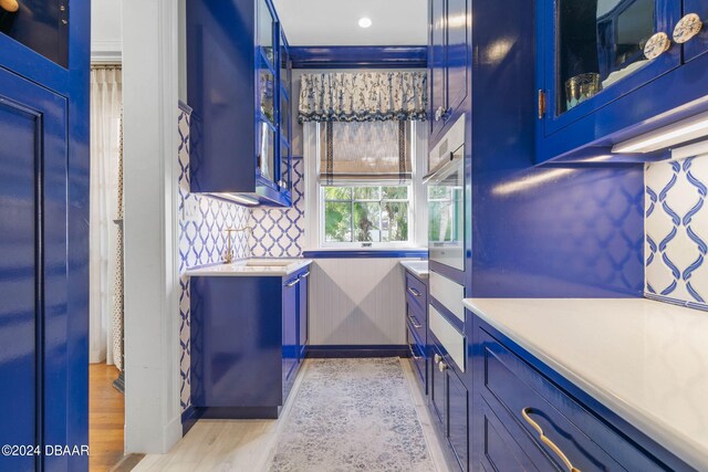 bathroom with sink and hardwood / wood-style flooring