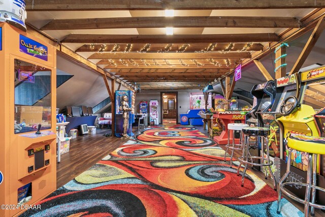 recreation room with wood-type flooring and beam ceiling