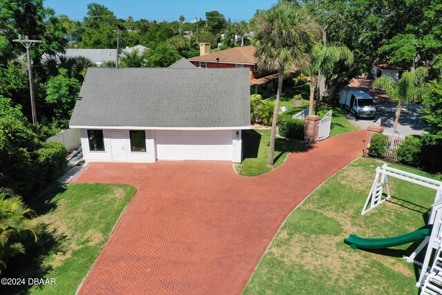 view of front of home featuring a playground and a front yard