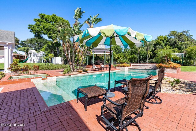 view of swimming pool featuring a patio area