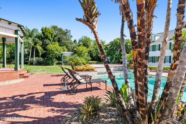 view of swimming pool featuring a patio