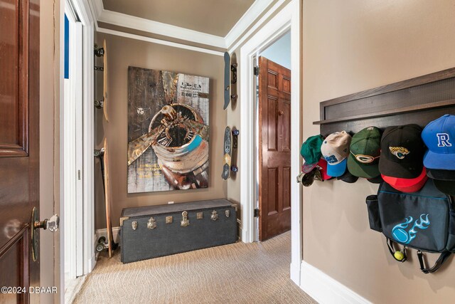 corridor featuring light colored carpet and crown molding