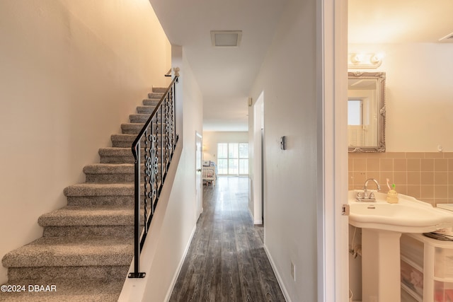 stairs with wood-type flooring