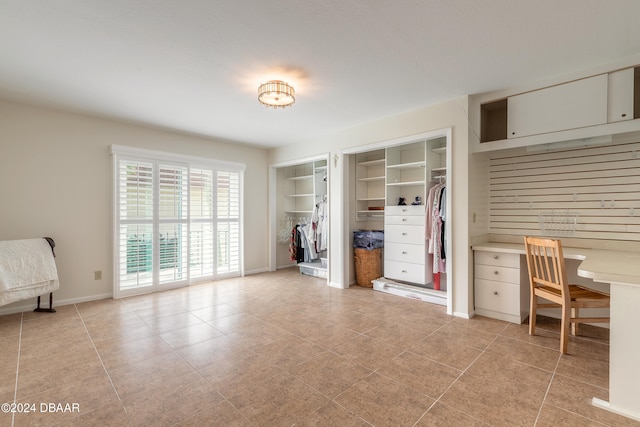 unfurnished office with light tile patterned flooring