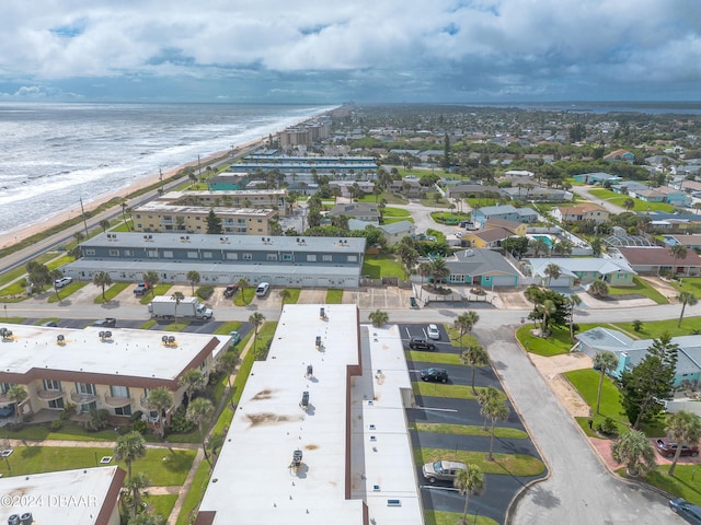 drone / aerial view featuring a view of the beach and a water view