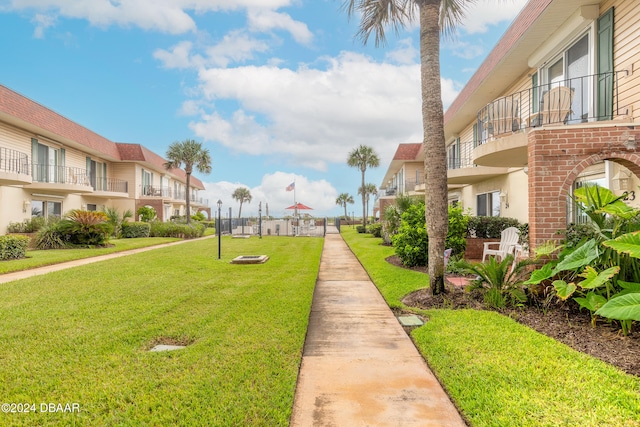 surrounding community featuring a yard